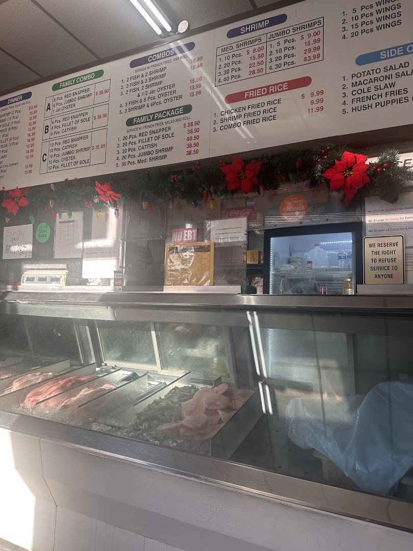 Takeout containers ready beside a busy counter.