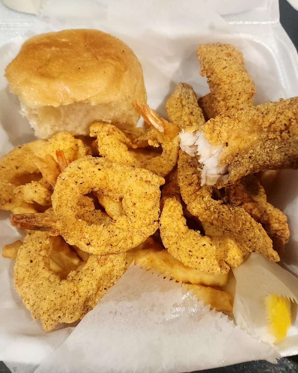 Printed menu with fish, shrimp, and wings.