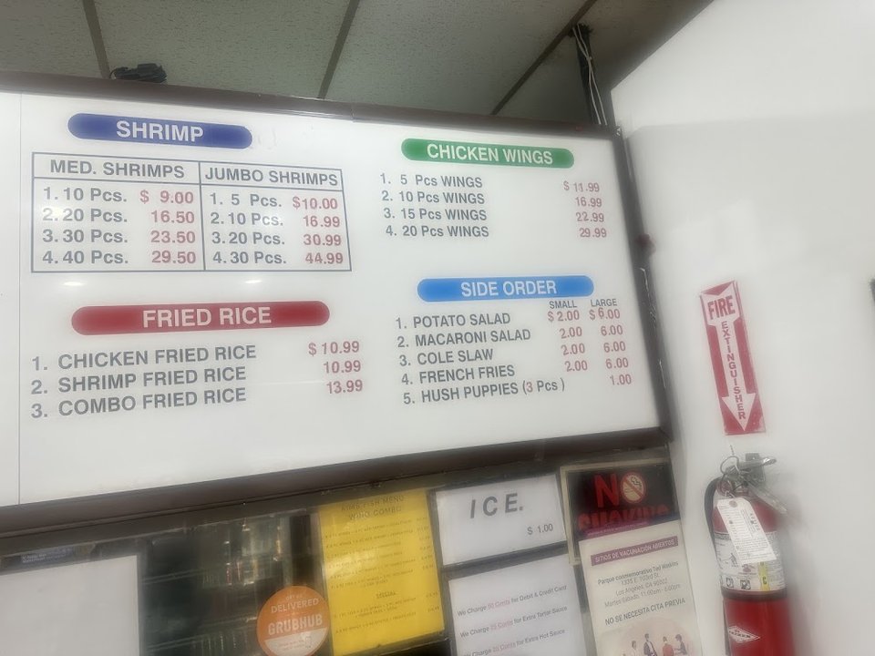 Printed menu with fish, shrimp, and wings.