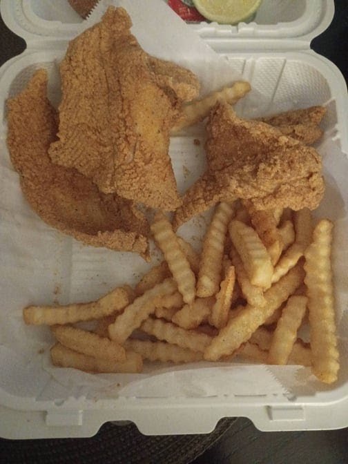 Printed menu with fish, shrimp, and wings.